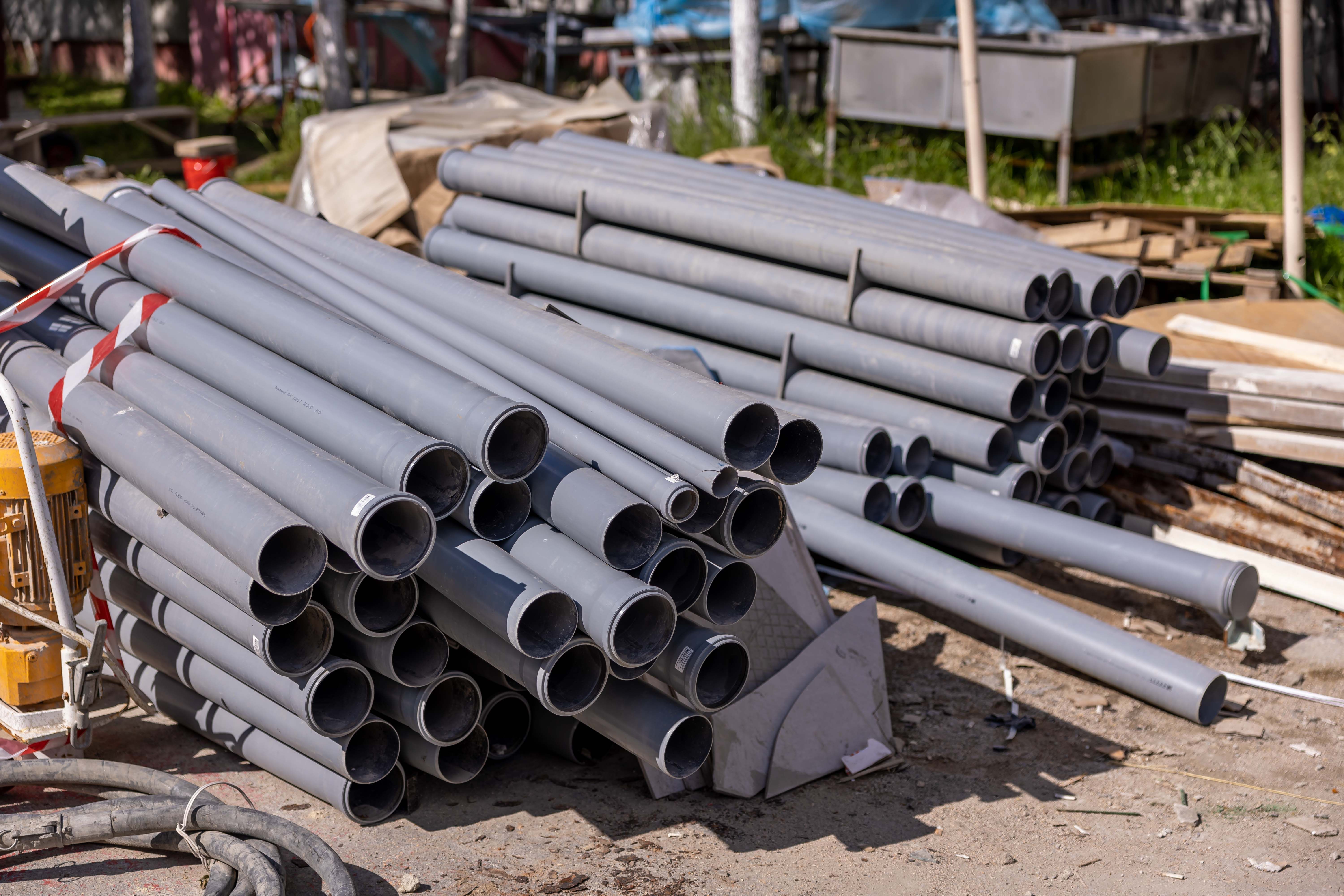 Extruded PVC pipe stacked on site